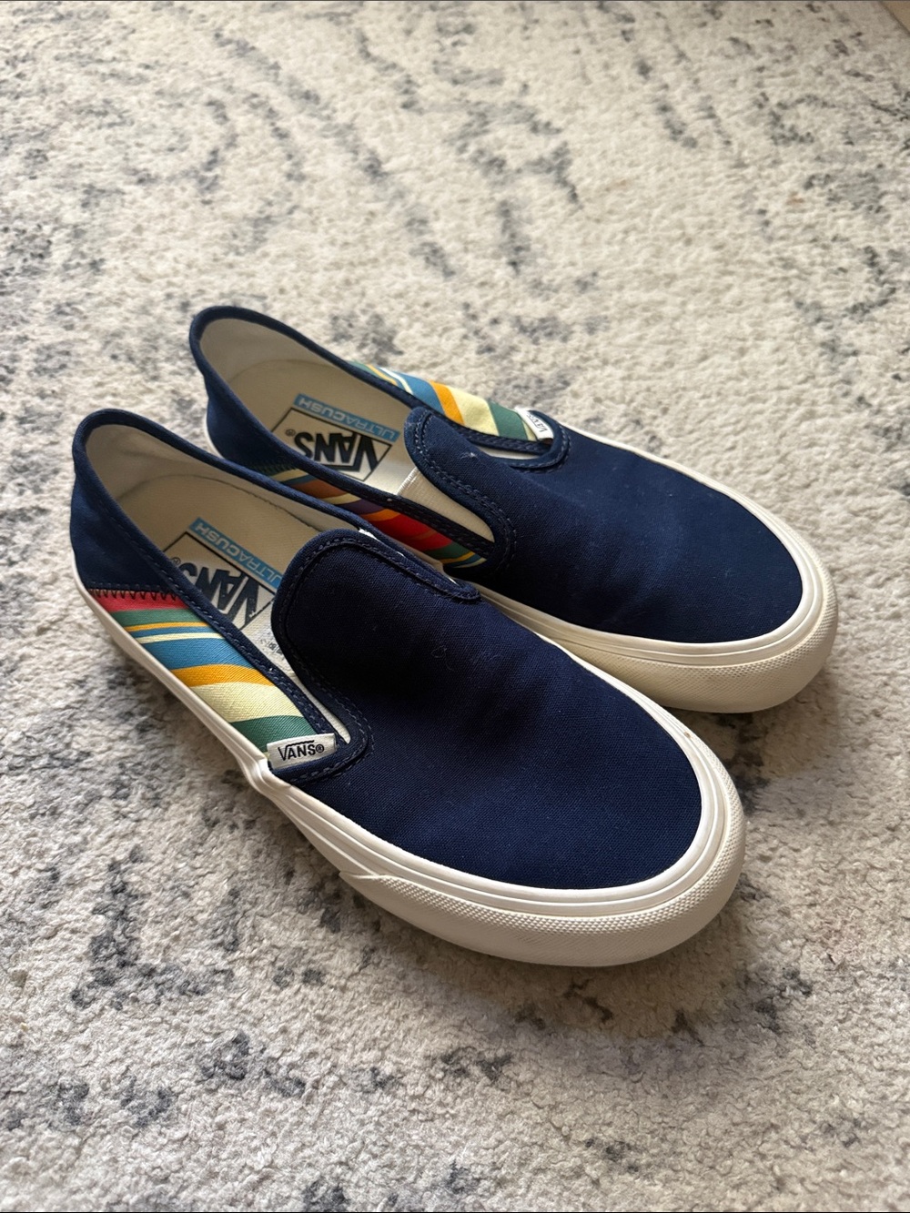 Vans Navy Slip-On with Rainbow Stripe Accent (women’s 7.5; men’s 6)